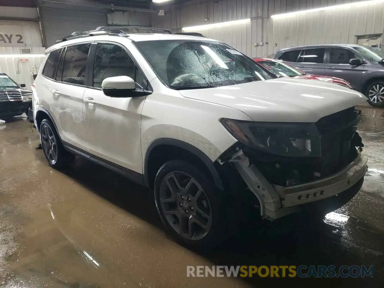4 Photograph of a damaged car 5FNYF8H59PB011459 HONDA PASSPORT 2023