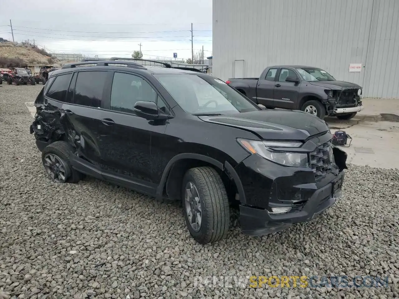 4 Photograph of a damaged car 5FNYF8H63PB010963 HONDA PASSPORT 2023