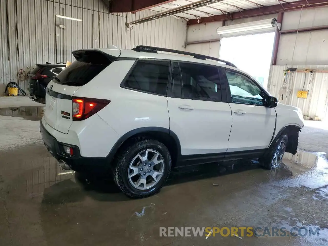 3 Photograph of a damaged car 5FNYF8H63PB023955 HONDA PASSPORT 2023