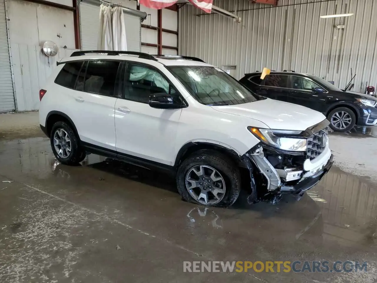 4 Photograph of a damaged car 5FNYF8H63PB023955 HONDA PASSPORT 2023