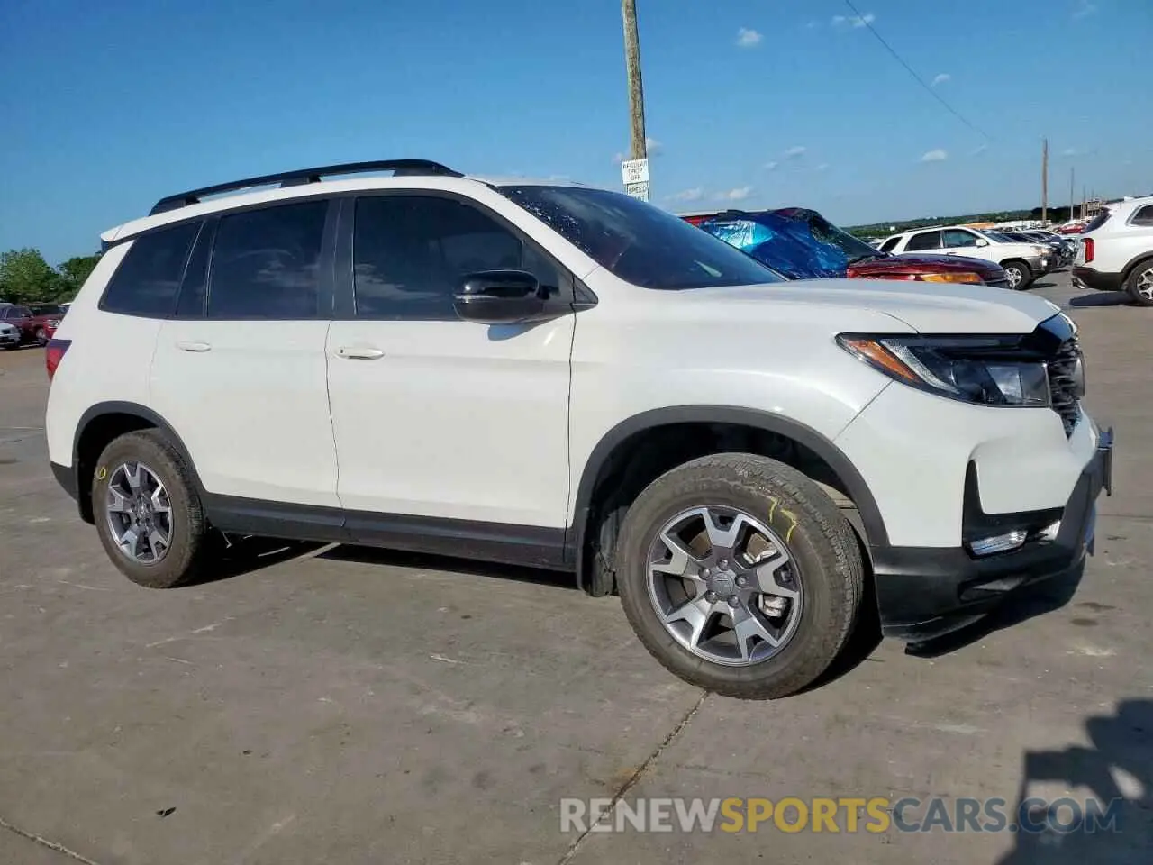4 Photograph of a damaged car 5FNYF8H64PB007652 HONDA PASSPORT 2023