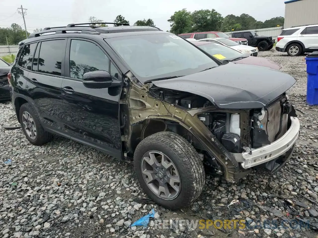 4 Photograph of a damaged car 5FNYF8H65PB000869 HONDA PASSPORT 2023