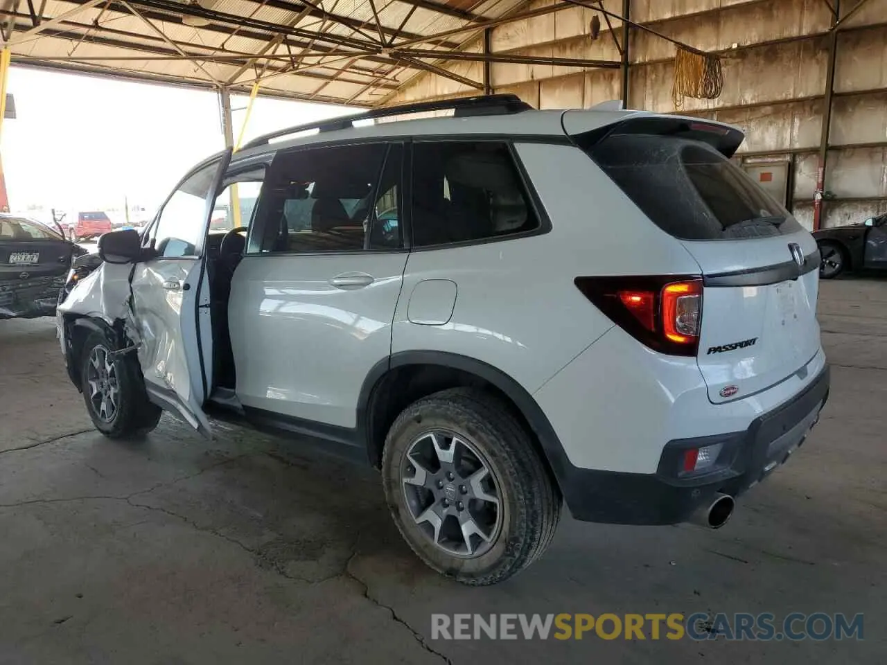 2 Photograph of a damaged car 5FNYF8H68PB000476 HONDA PASSPORT 2023
