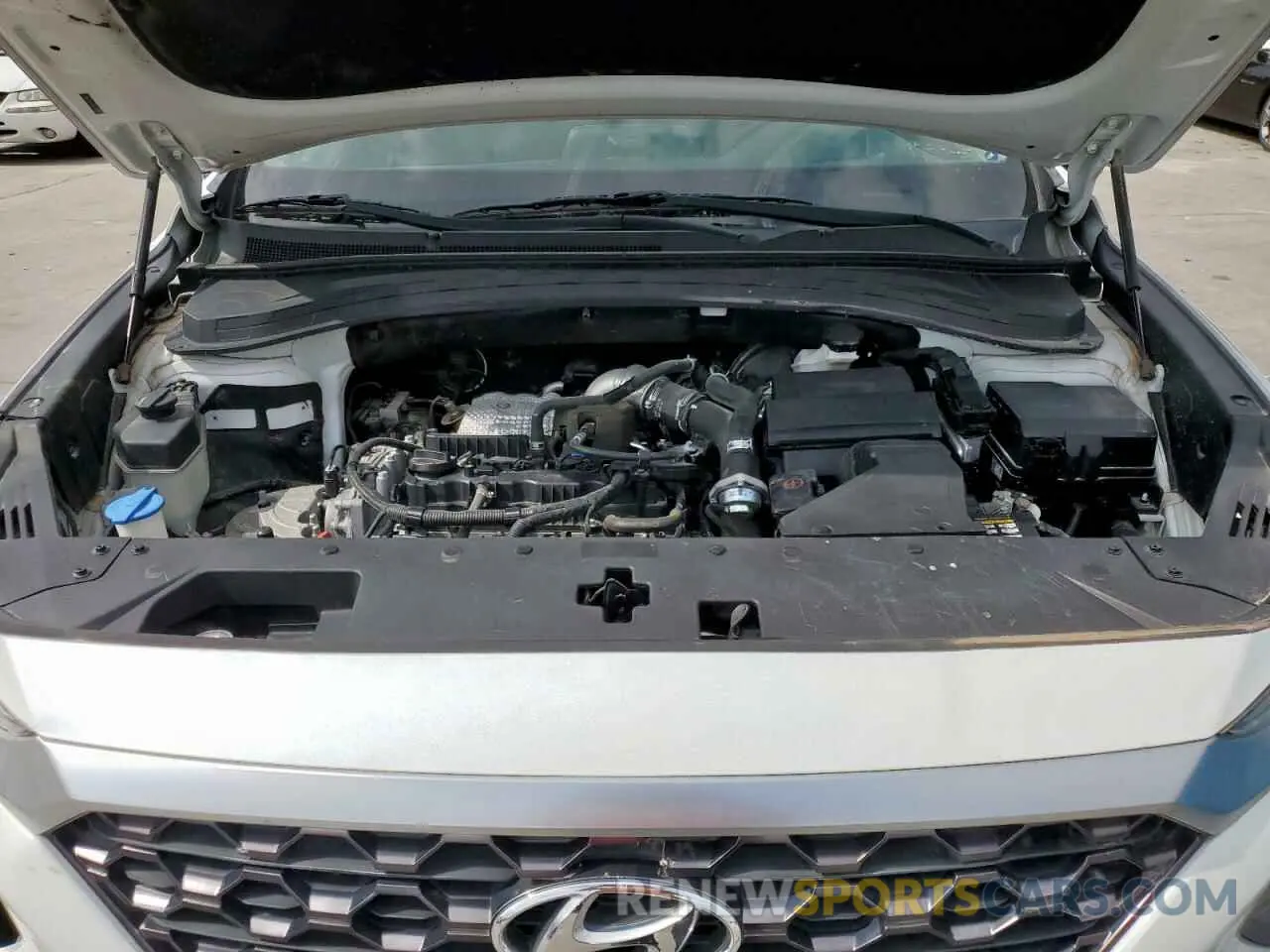 12 Photograph of a damaged car 5NMS5CAA3KH012794 HYUNDAI SANTA FE 2019