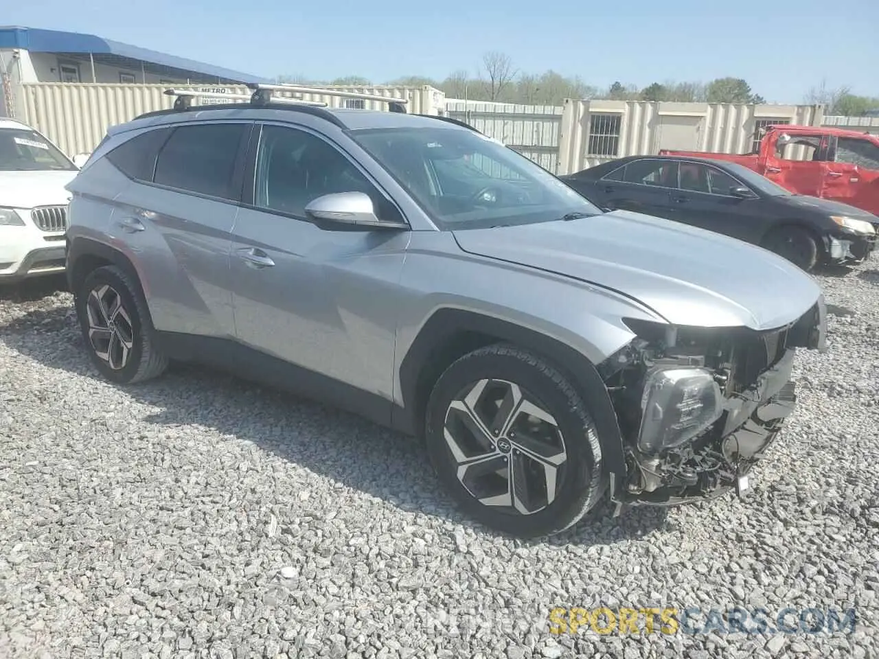 4 Photograph of a damaged car 5NMJC3AE6NH130654 HYUNDAI TUCSON 2022