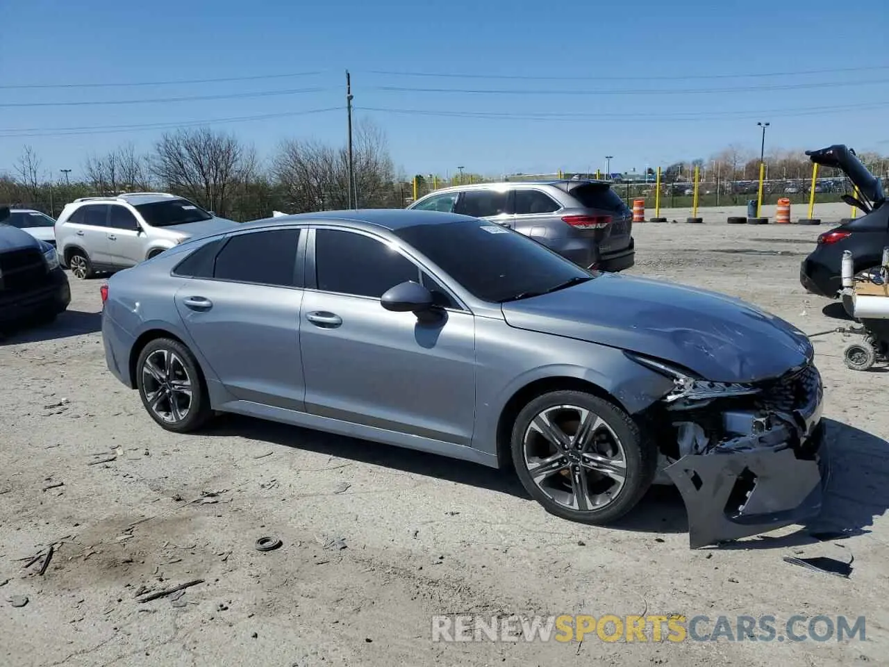 4 Photograph of a damaged car 5XXG14J21NG100102 KIA K5 2022