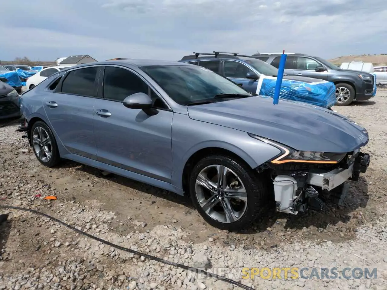 4 Photograph of a damaged car 5XXG14J23NG136938 KIA K5 2022