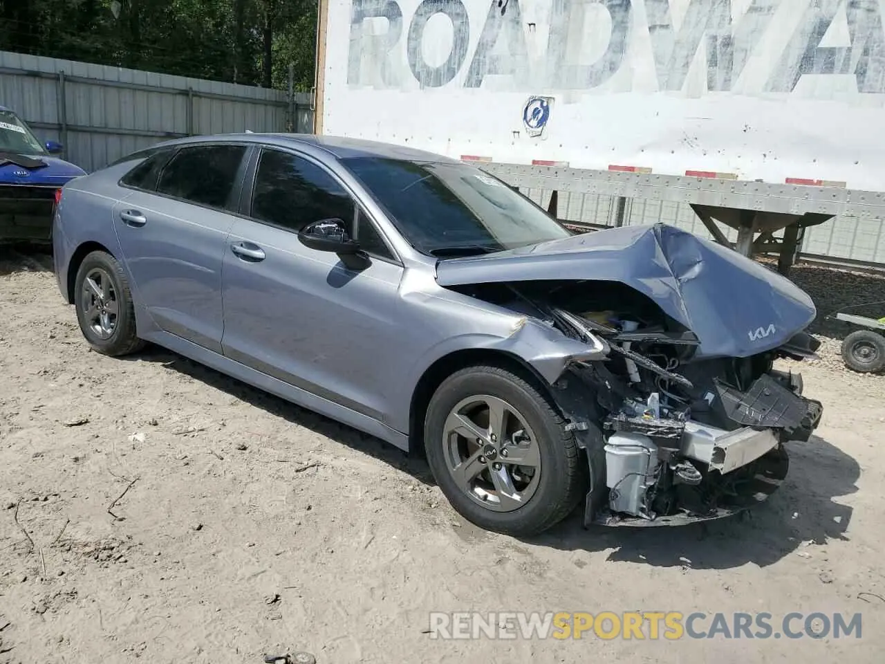 4 Photograph of a damaged car 5XXG14J23NG139967 KIA K5 2022
