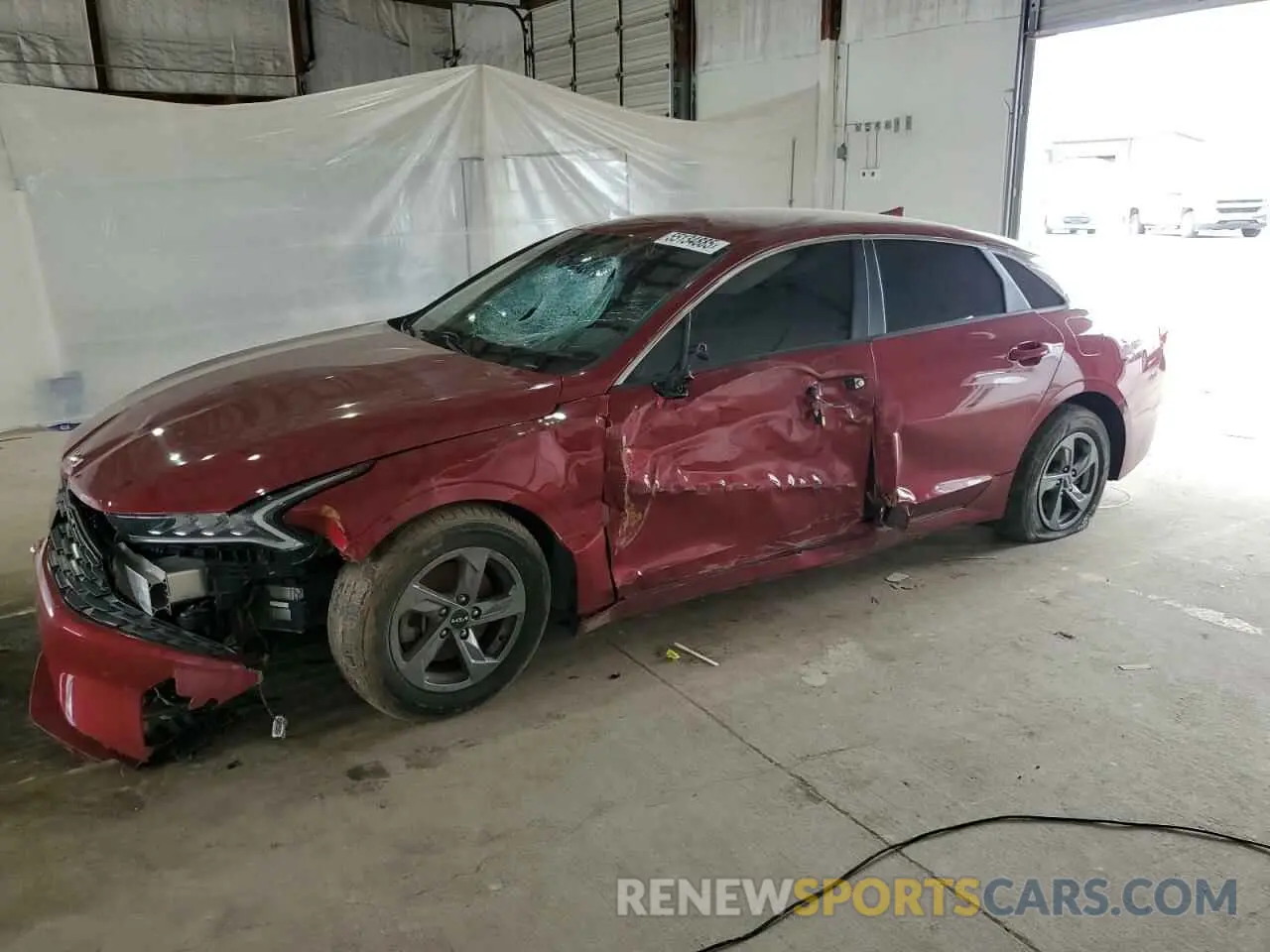 1 Photograph of a damaged car 5XXG14J25NG148377 KIA K5 2022
