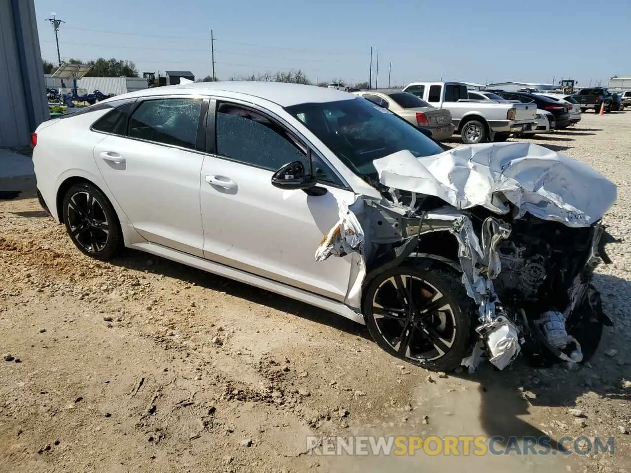 4 Photograph of a damaged car 5XXG64J21NG105494 KIA K5 2022