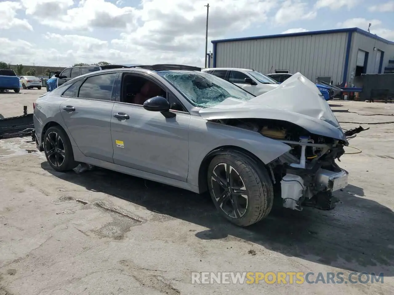 4 Photograph of a damaged car 5XXG64J21NG123395 KIA K5 2022