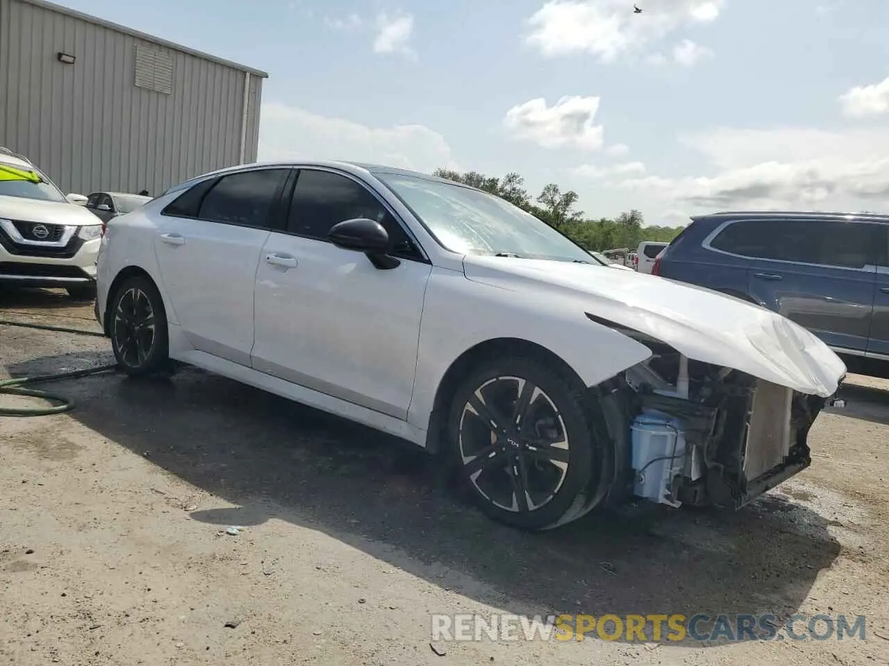 4 Photograph of a damaged car 5XXG64J27NG127872 KIA K5 2022