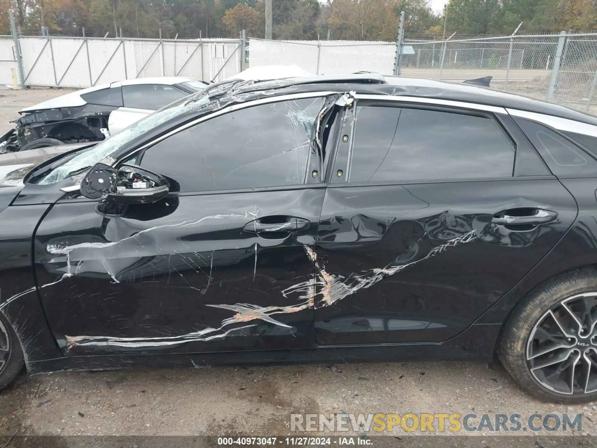 14 Photograph of a damaged car 5XXG44J83PG200331 KIA K5 2023