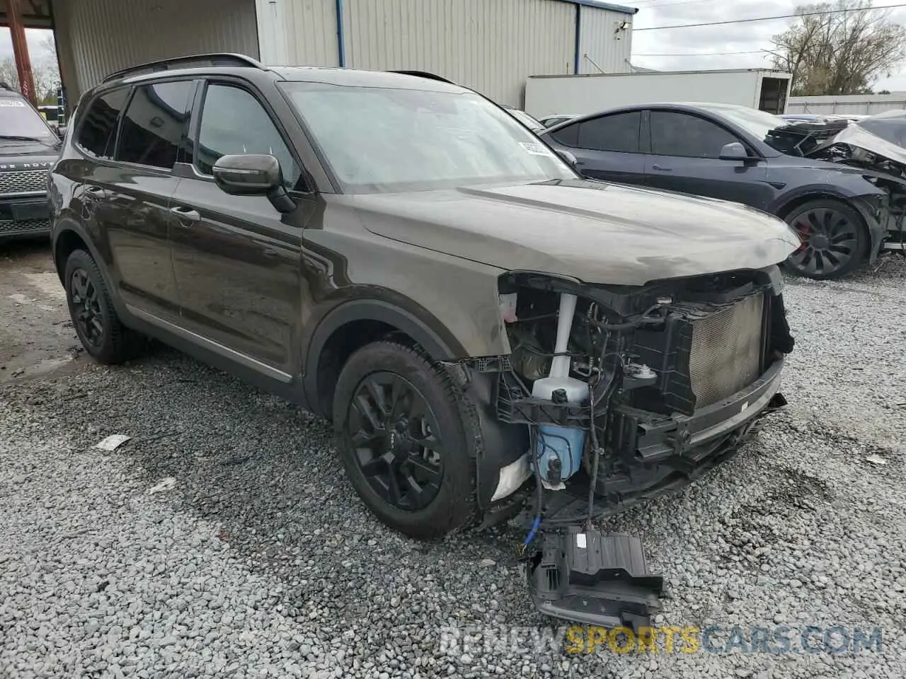 4 Photograph of a damaged car 5XYP5DGC3PG336673 KIA TELLURIDE 2023