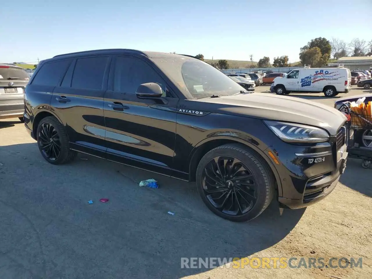 4 Photograph of a damaged car 5LM5J7WC1PGL14599 LINCOLN AVIATOR 2023