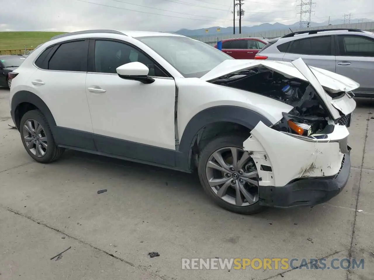 4 Photograph of a damaged car 3MVDMBBL9NM411859 MAZDA CX30 2022