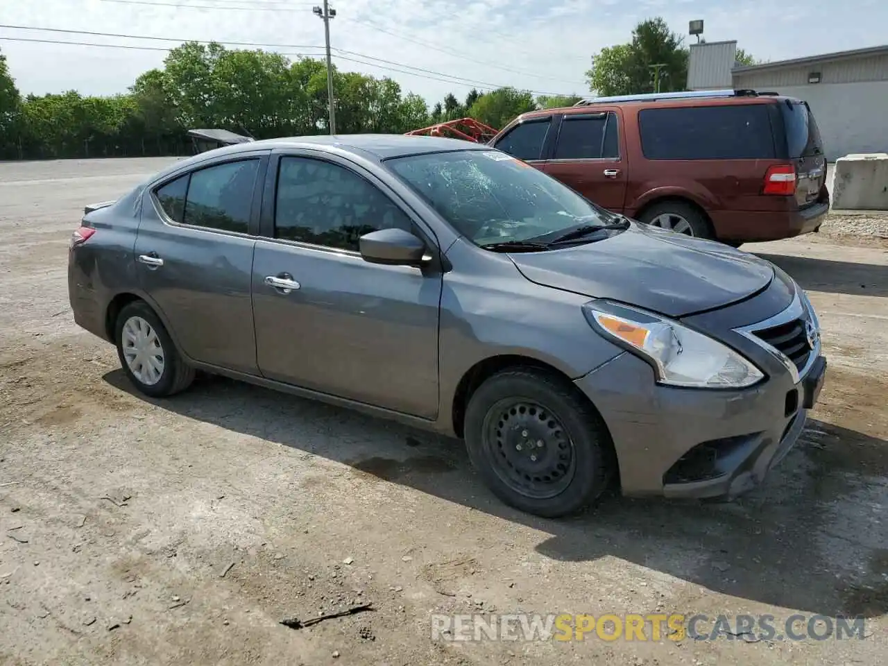 4 Photograph of a damaged car 3N1CN7AP3KL82257X NISSAN VERSA 2019