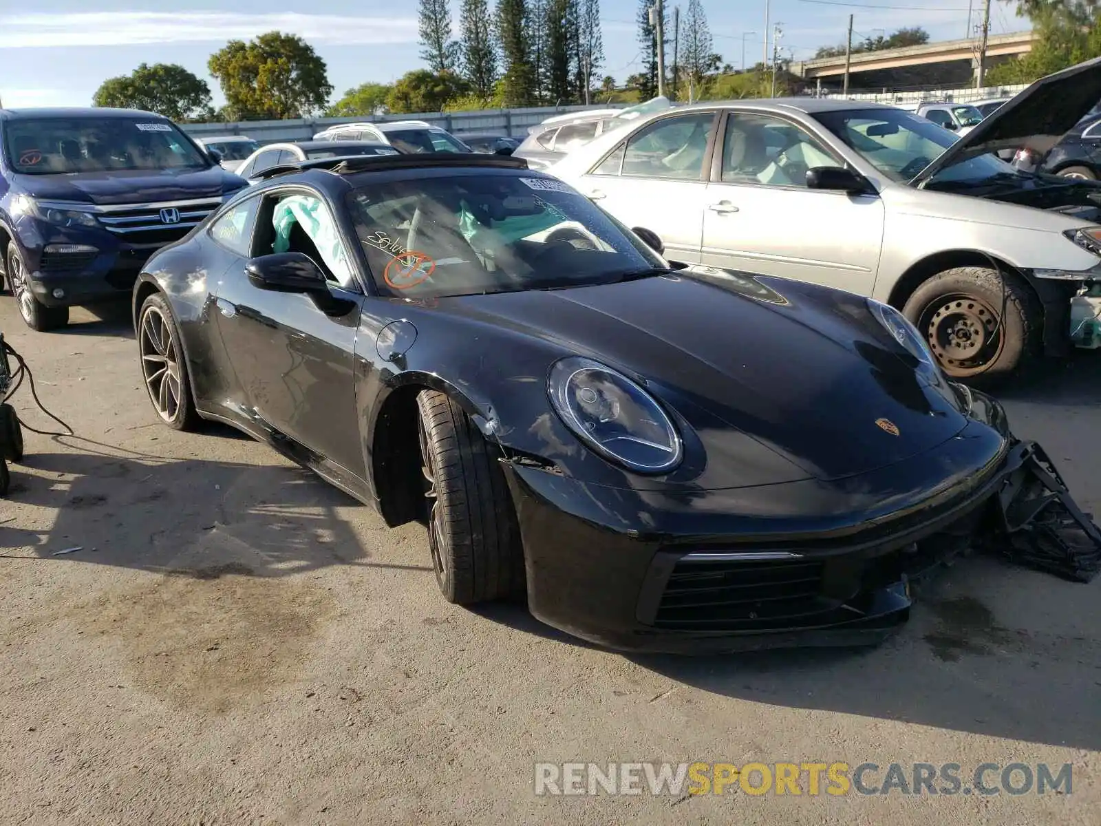 1 Photograph of a damaged car WP0AB2A95LS227491 PORSCHE 911 2020