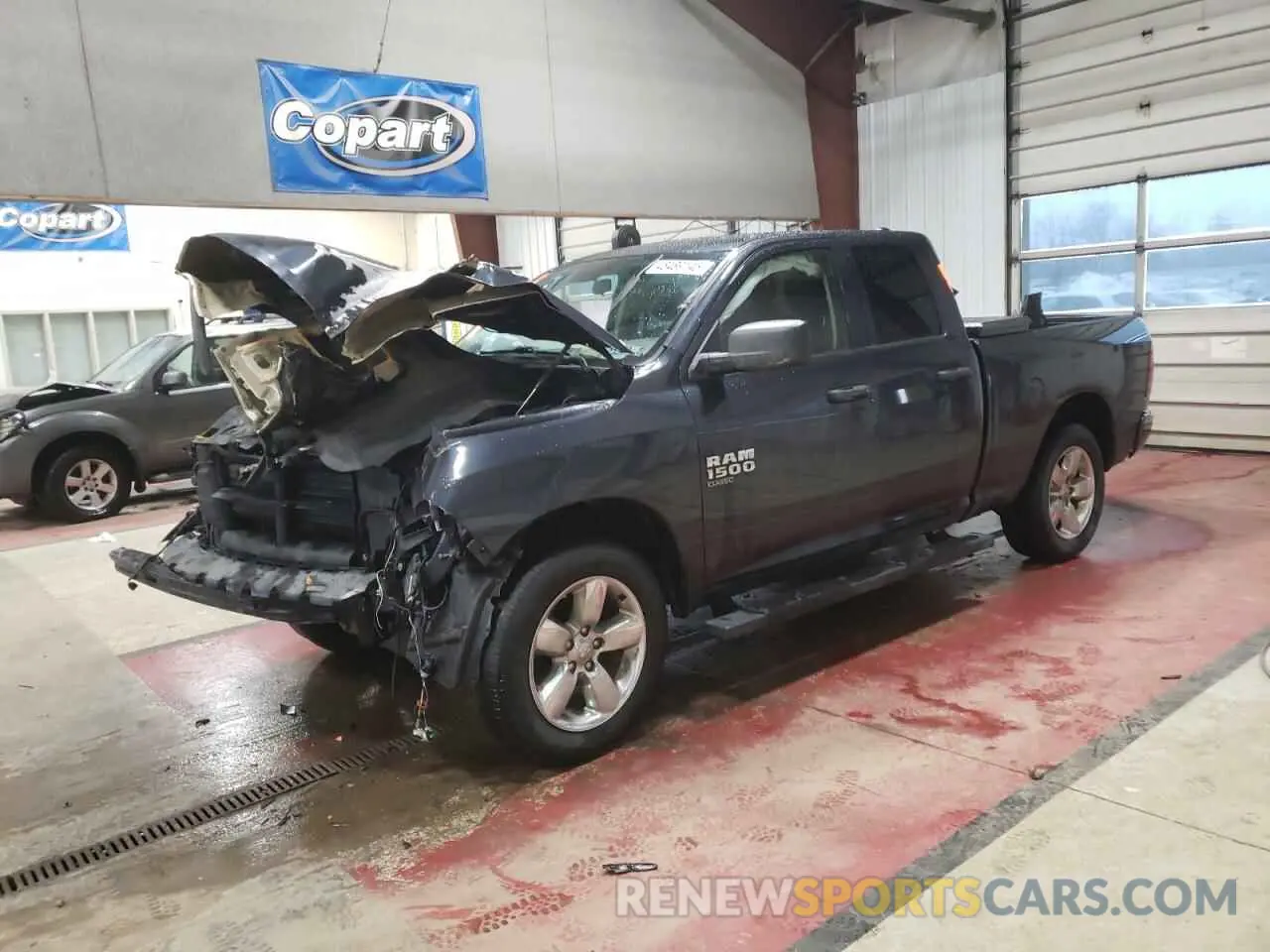 1 Photograph of a damaged car 1C6RR7FG0KS705471 RAM 1500 2019