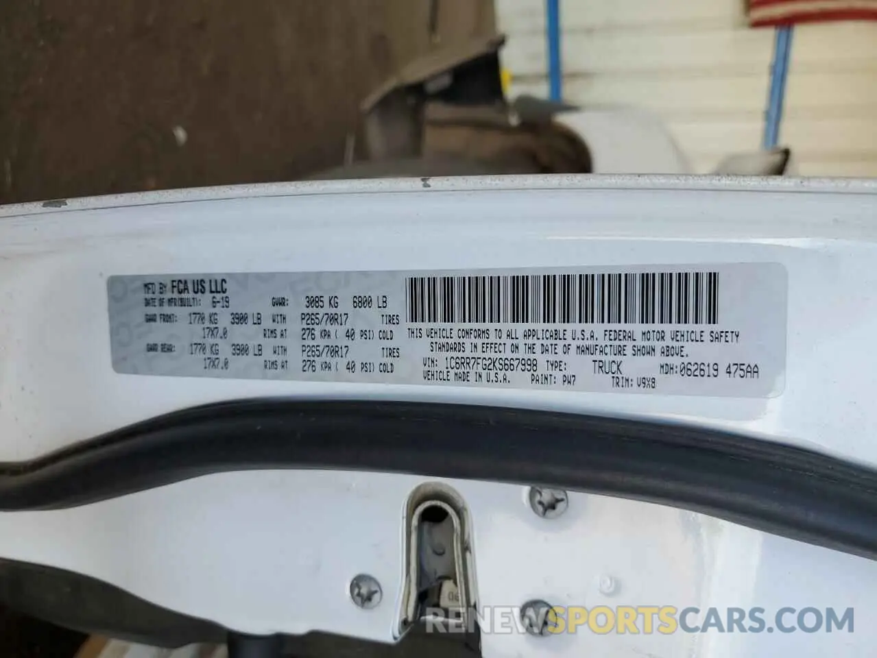 14 Photograph of a damaged car 1C6RR7FG2KS667998 RAM 1500 2019
