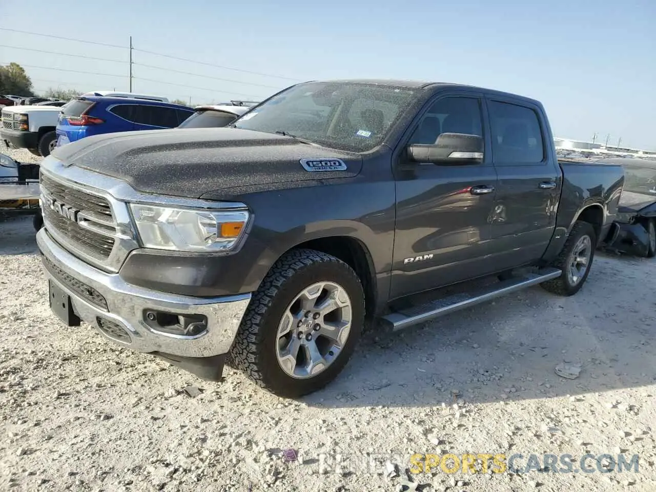 1 Photograph of a damaged car 1C6RREFT2KN798512 RAM 1500 2019