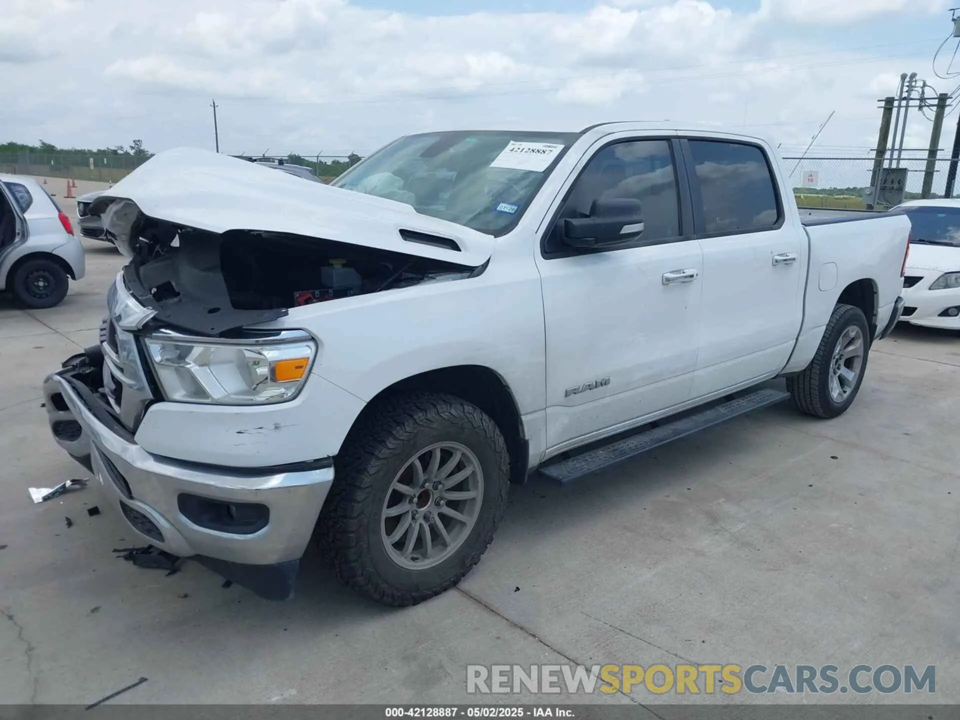 2 Photograph of a damaged car 1C6RREFT3KN581499 RAM 1500 2019