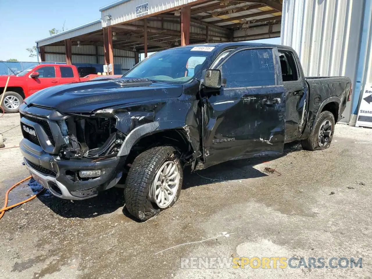 1 Photograph of a damaged car 1C6RRELT0KN828238 RAM 1500 2019
