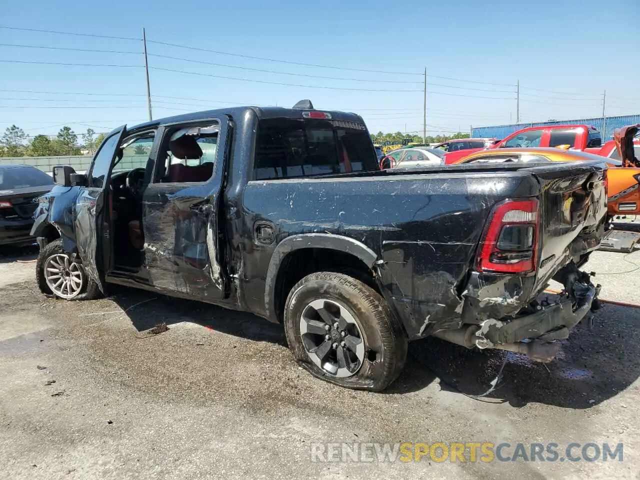 2 Photograph of a damaged car 1C6RRELT0KN828238 RAM 1500 2019