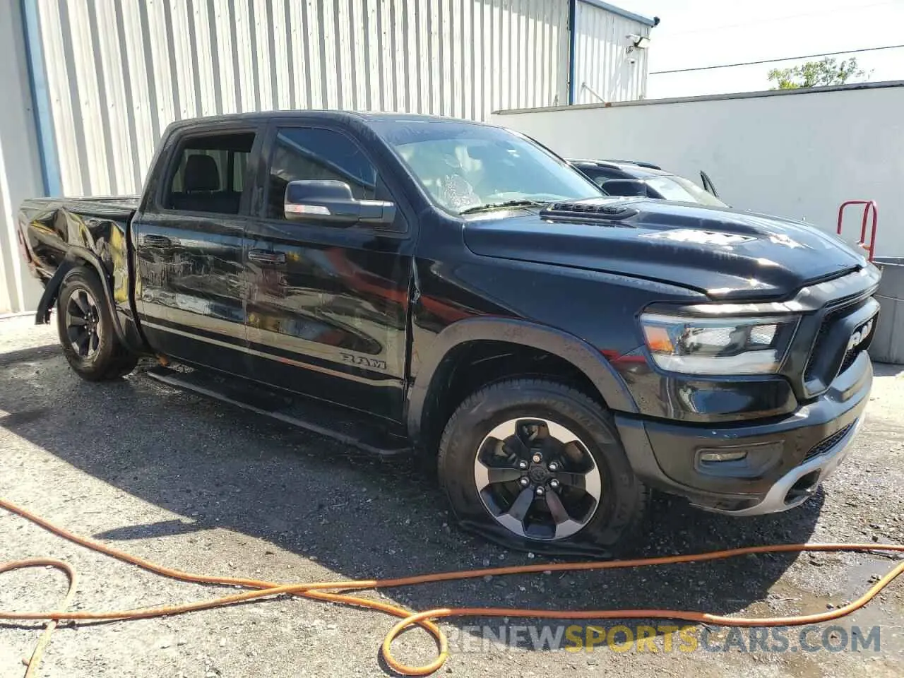 4 Photograph of a damaged car 1C6RRELT0KN828238 RAM 1500 2019