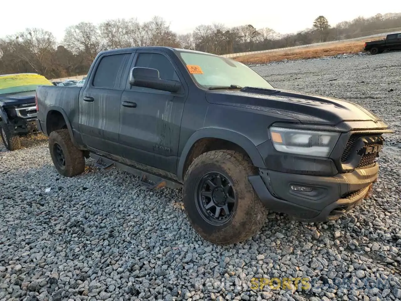 4 Photograph of a damaged car 1C6RRELT2KN724222 RAM 1500 2019