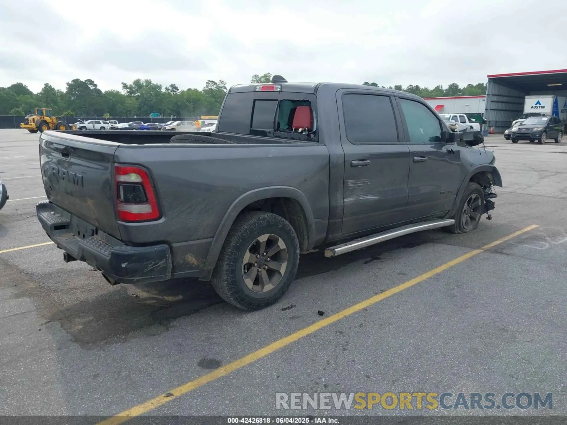 4 Photograph of a damaged car 1C6RRELT5KN625118 RAM 1500 2019