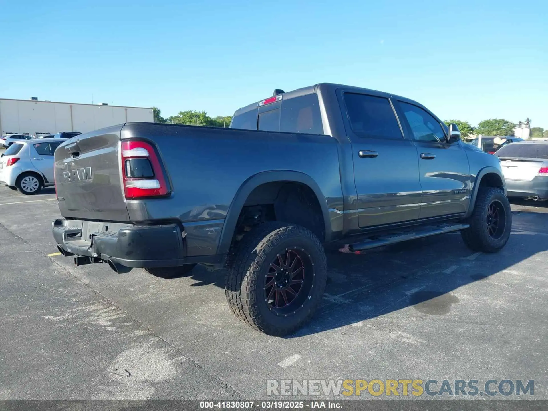 4 Photograph of a damaged car 1C6RRELT8KN549233 RAM 1500 2019