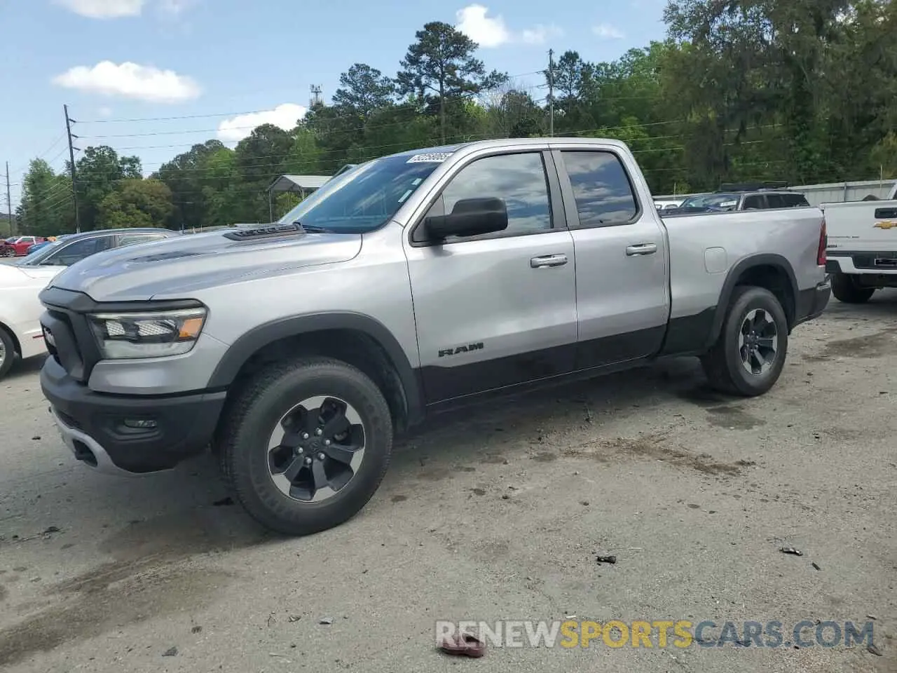 1 Photograph of a damaged car 1C6SRFET1KN875363 RAM 1500 2019