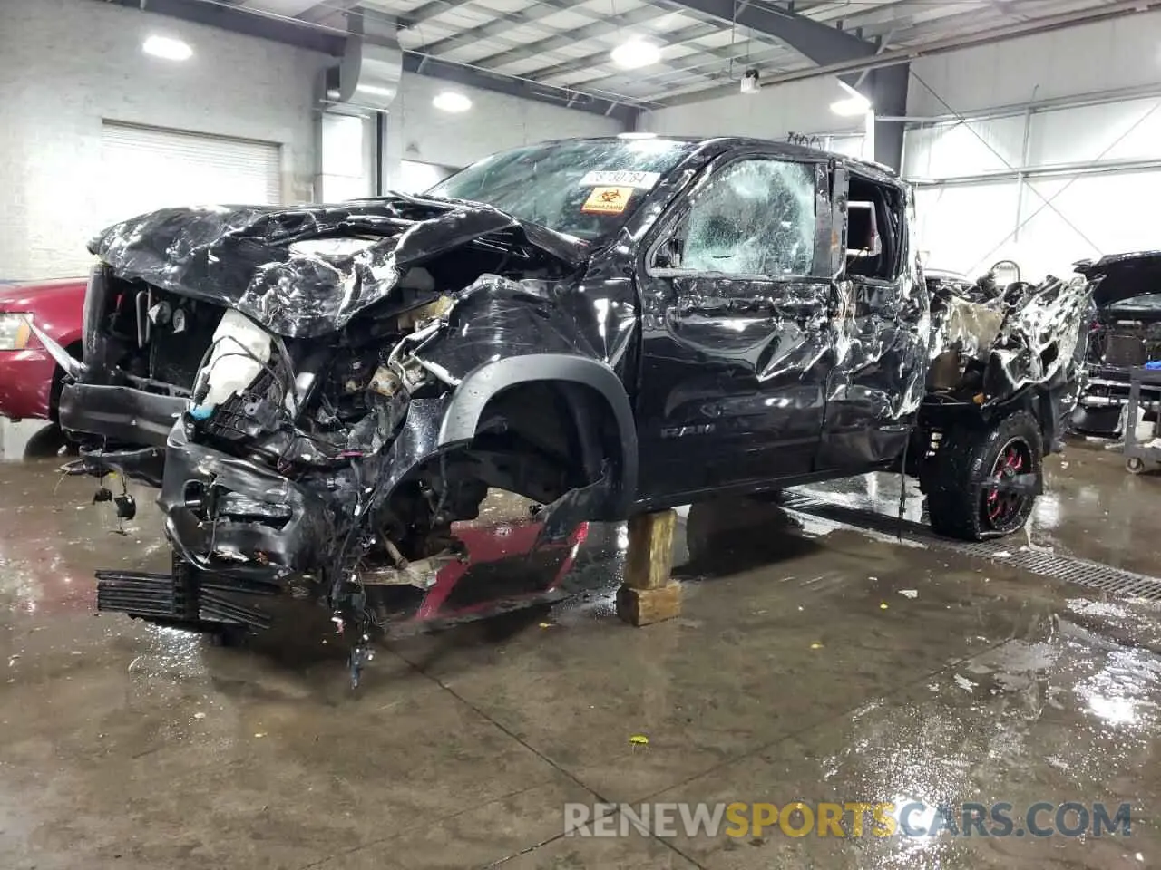 1 Photograph of a damaged car 1C6SRFET2KN565965 RAM 1500 2019