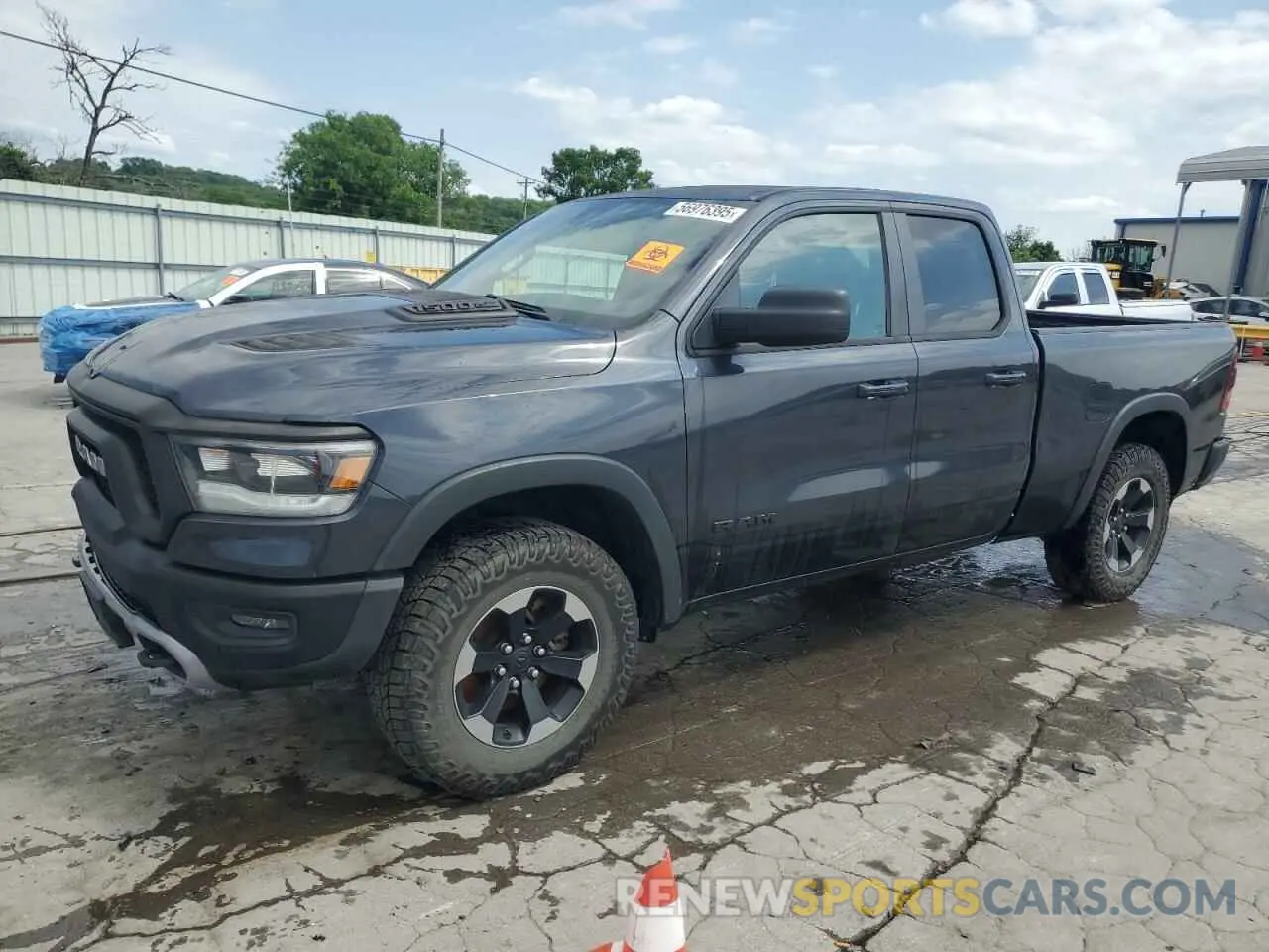 1 Photograph of a damaged car 1C6SRFET7KN822540 RAM 1500 2019