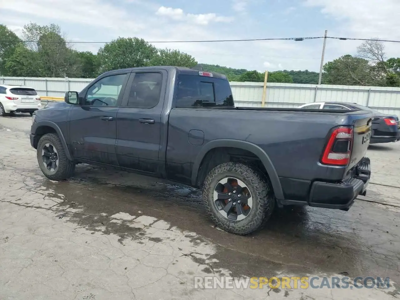 2 Photograph of a damaged car 1C6SRFET7KN822540 RAM 1500 2019