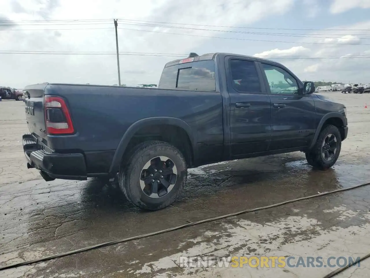 3 Photograph of a damaged car 1C6SRFET7KN822540 RAM 1500 2019