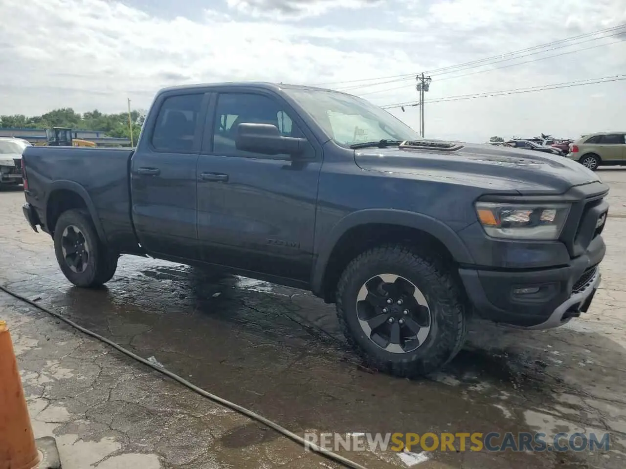 4 Photograph of a damaged car 1C6SRFET7KN822540 RAM 1500 2019