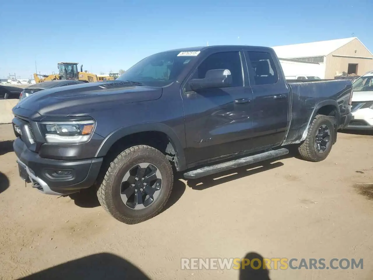 1 Photograph of a damaged car 1C6SRFET7KN865176 RAM 1500 2019