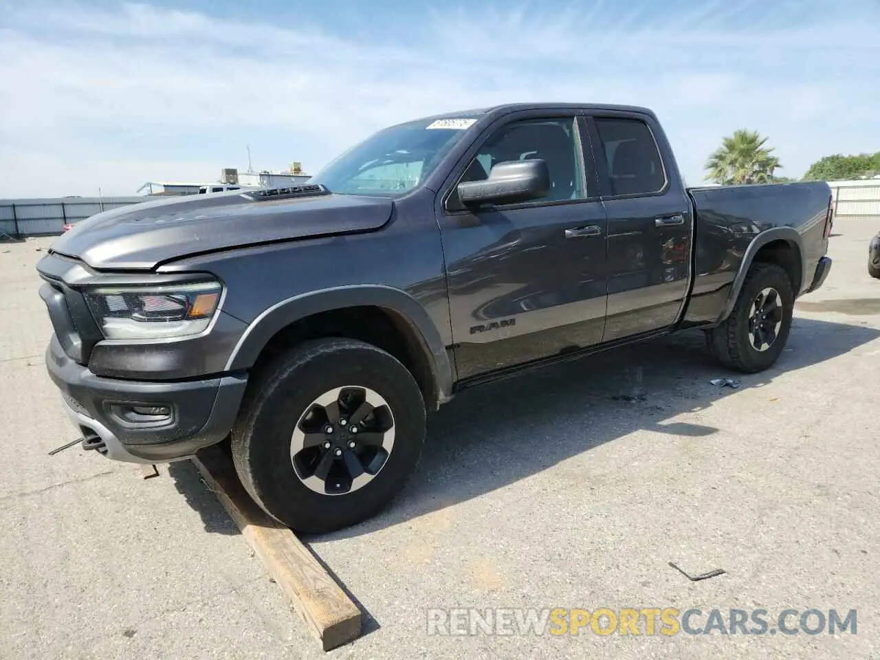 1 Photograph of a damaged car 1C6SRFET7KN875819 RAM 1500 2019