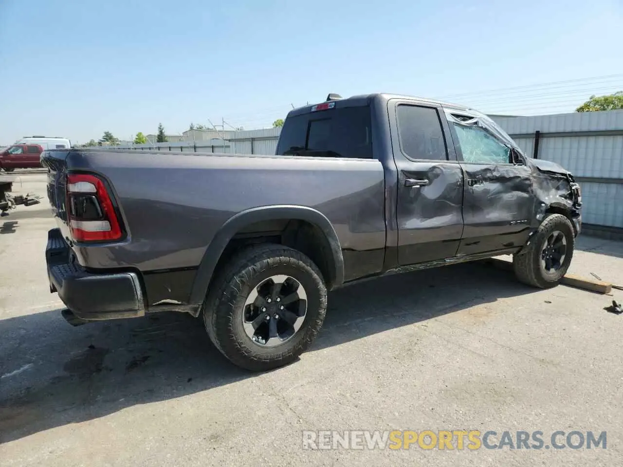 3 Photograph of a damaged car 1C6SRFET7KN875819 RAM 1500 2019