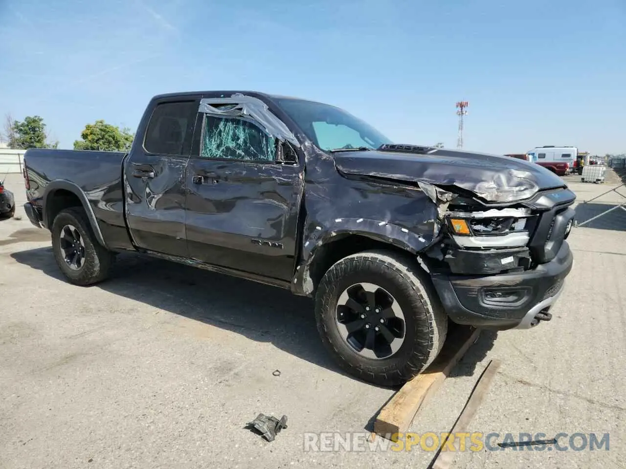 4 Photograph of a damaged car 1C6SRFET7KN875819 RAM 1500 2019