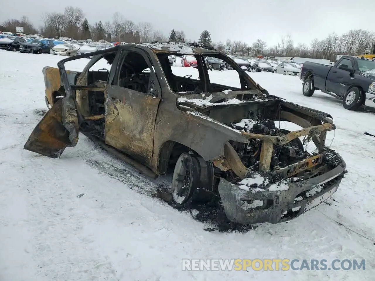 4 Photograph of a damaged car 1C6SRFFT0KN743063 RAM 1500 2019