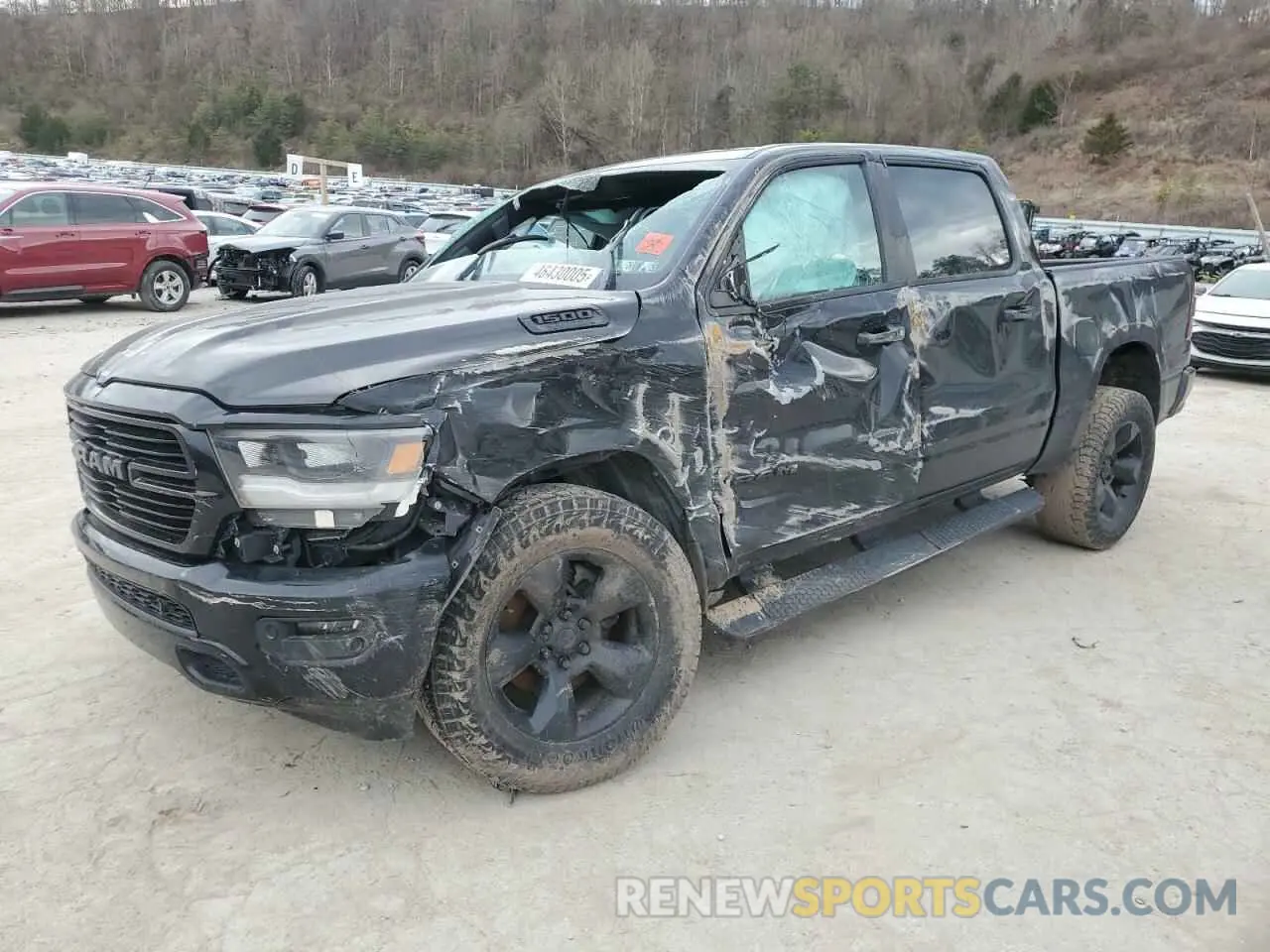 1 Photograph of a damaged car 1C6SRFFT3KN523397 RAM 1500 2019