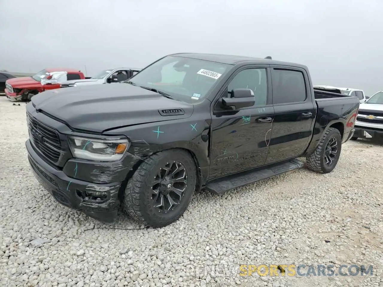 1 Photograph of a damaged car 1C6SRFFT3KN909351 RAM 1500 2019