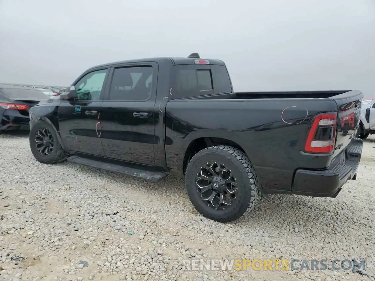 2 Photograph of a damaged car 1C6SRFFT3KN909351 RAM 1500 2019