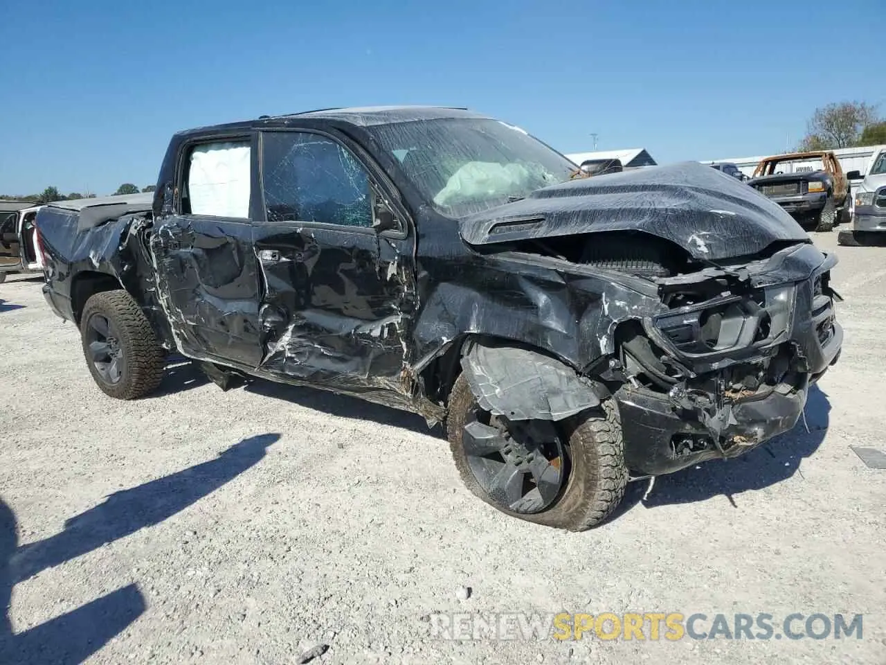 4 Photograph of a damaged car 1C6SRFFT4KN583771 RAM 1500 2019