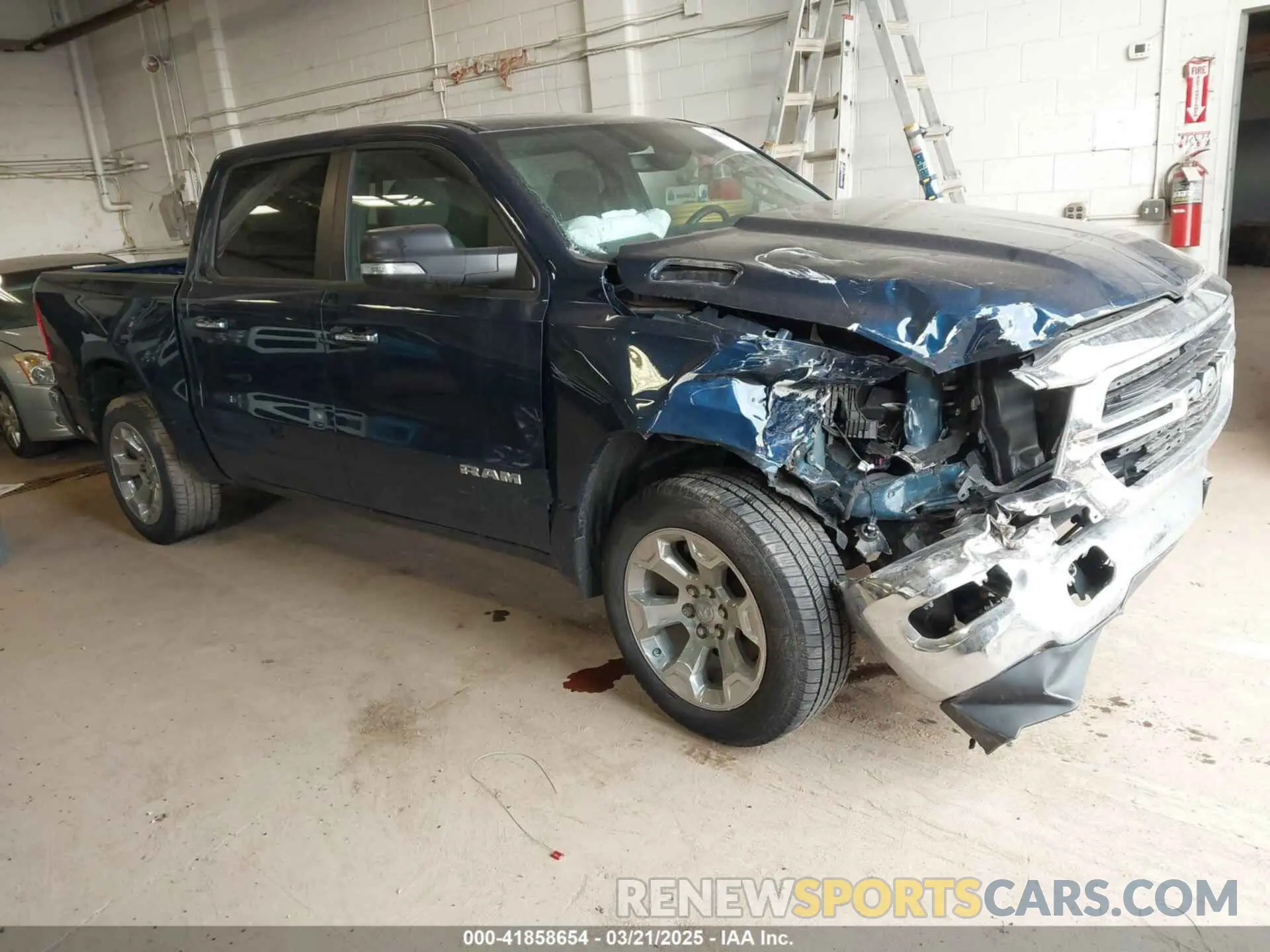 1 Photograph of a damaged car 1C6SRFFT5KN762580 RAM 1500 2019