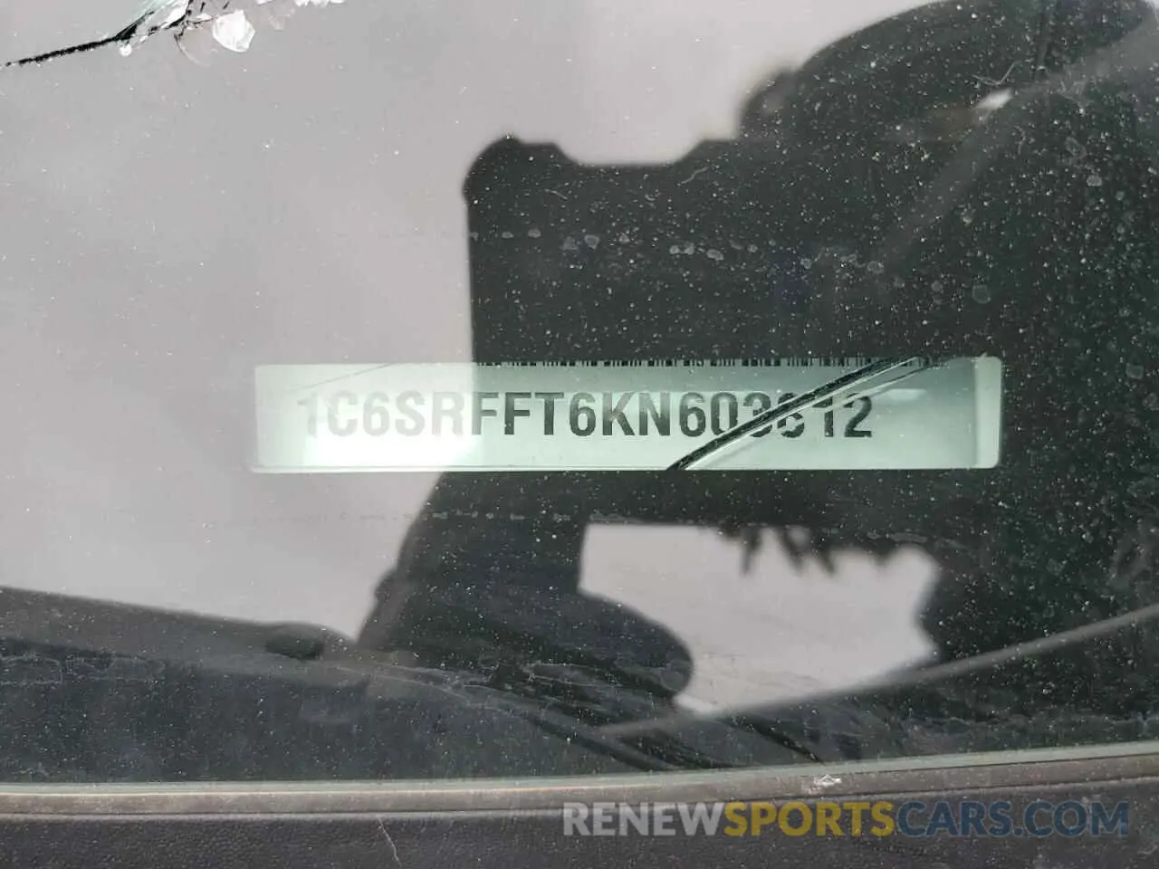 13 Photograph of a damaged car 1C6SRFFT6KN603812 RAM 1500 2019