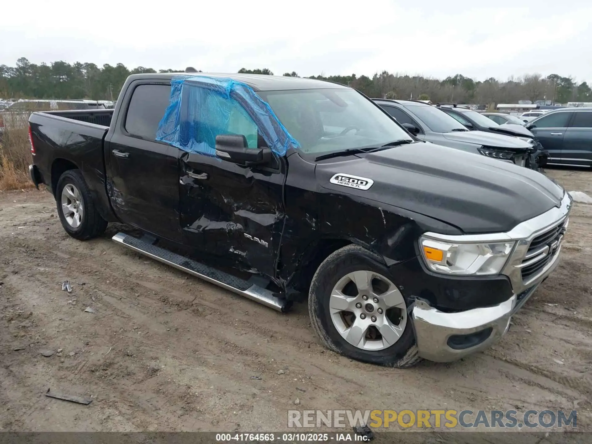 1 Photograph of a damaged car 1C6SRFFT7KN589502 RAM 1500 2019